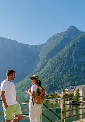 Couple looking at each other near a lake - Preferred Travel